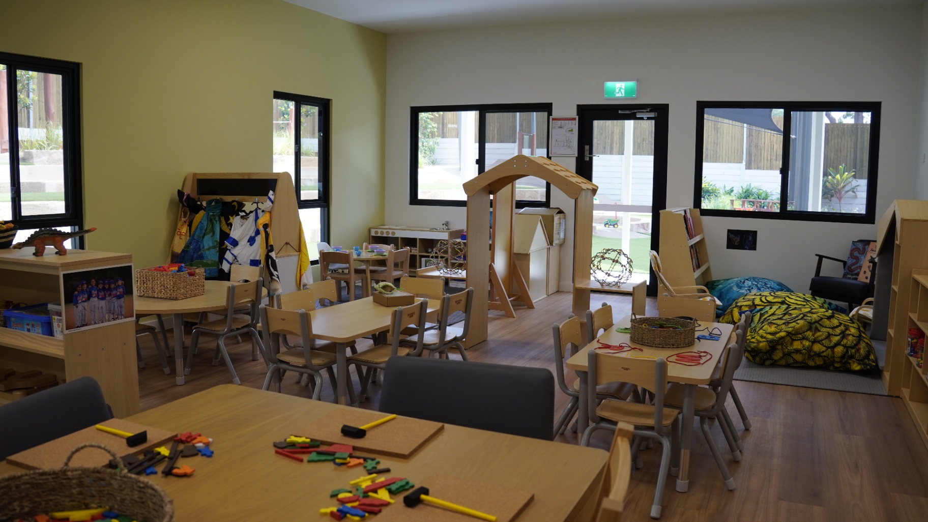 Light-filled Greenbank Covella classroom with timber furniture and reading nook