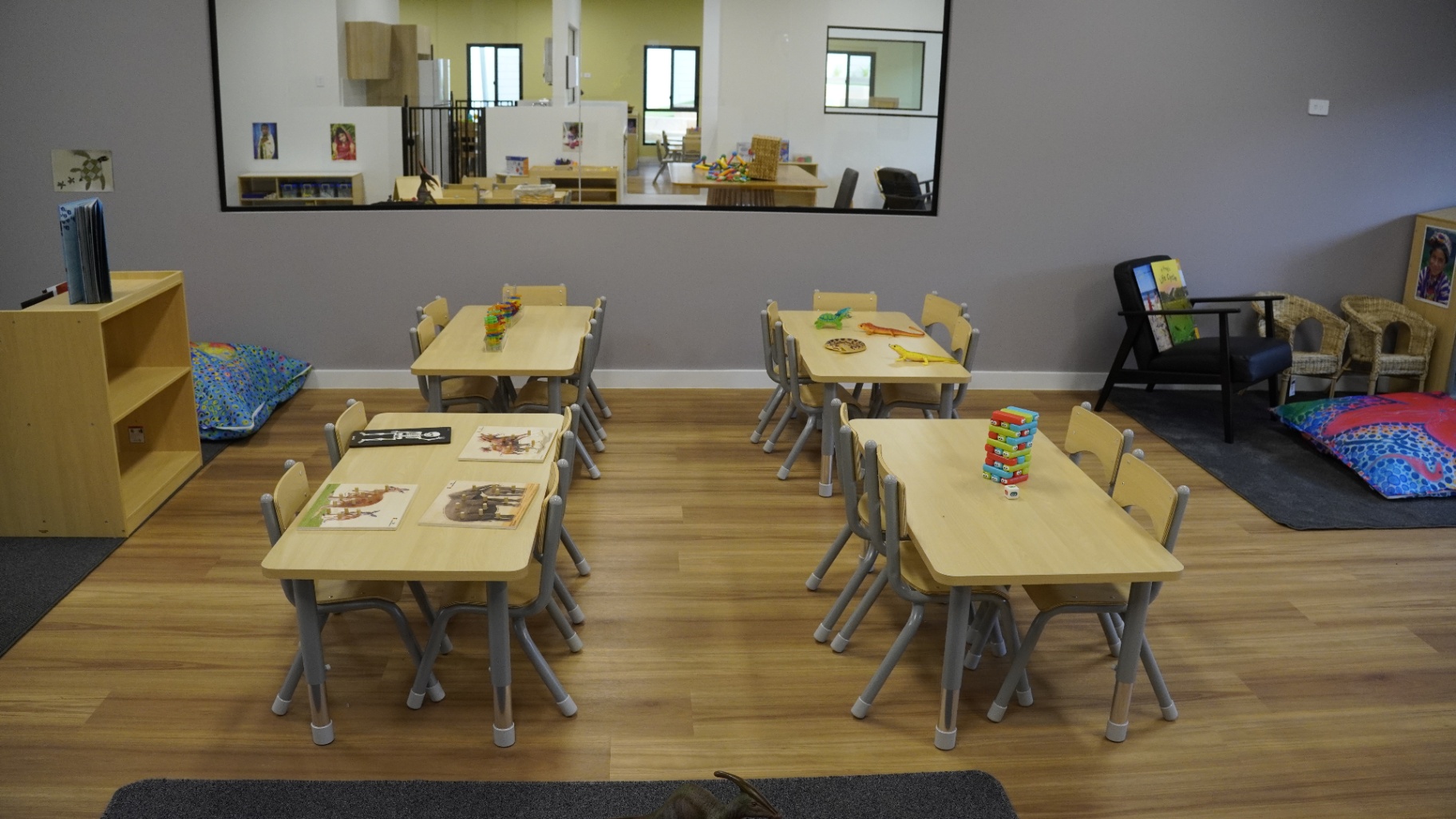 Greenbank Covella learning room with kindy tables, books and cosy reading corner